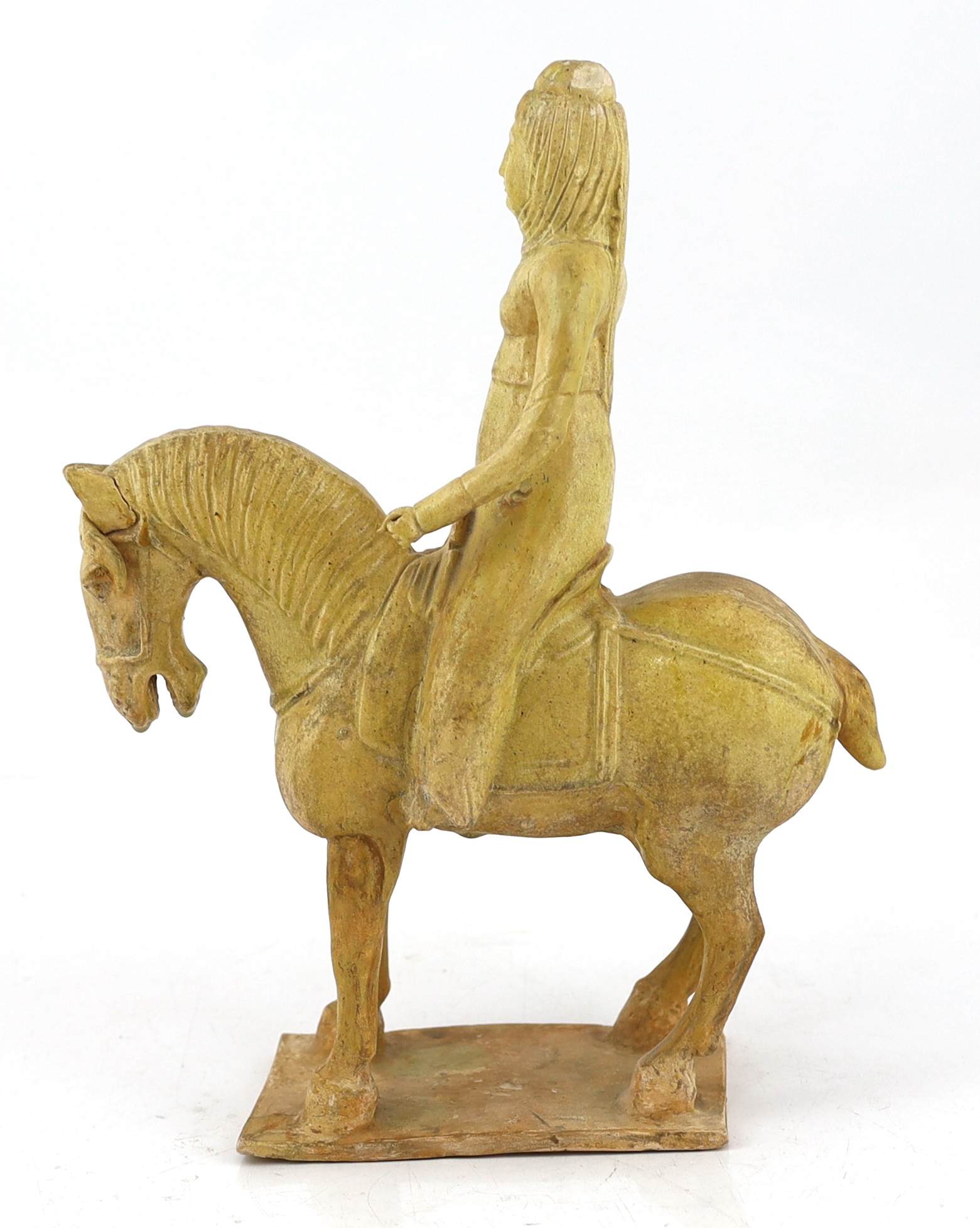 A Chinese straw glazed pottery model of a horse and female rider, Tang dynasty (618-906 AD)